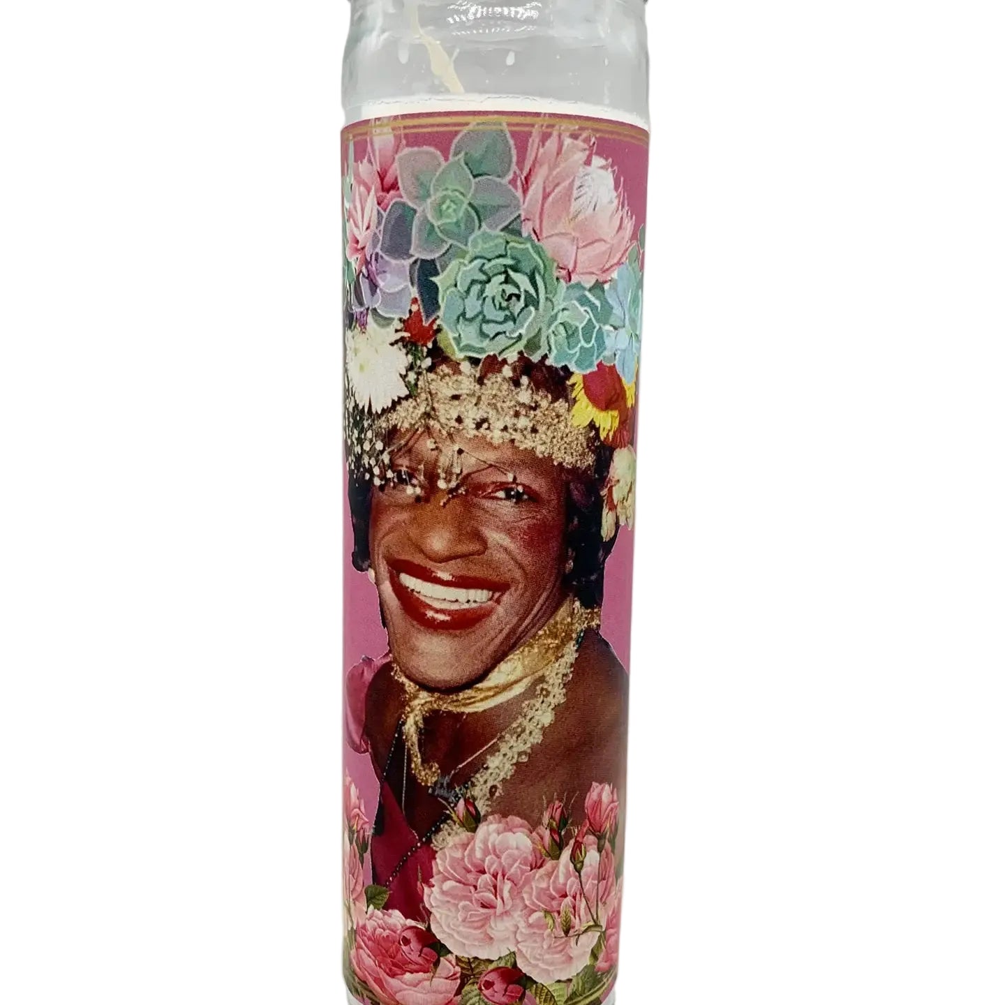 Candle with a colorful design featuring a smiling person and flowers on a white background