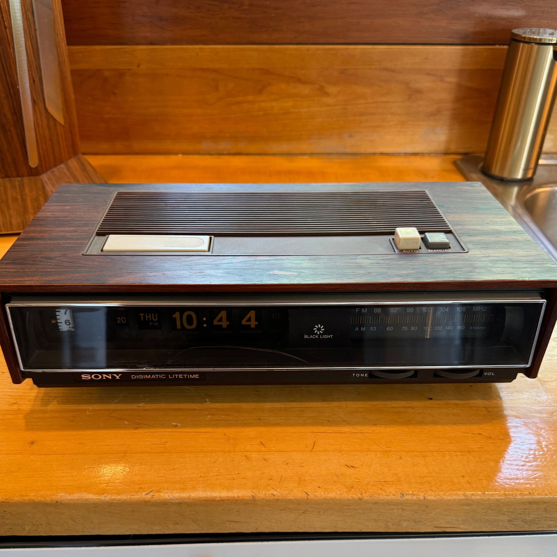 Vintage Sony clock radio on a wooden surface