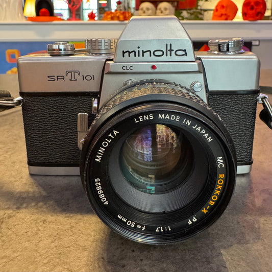 Minolta SR-T 101 is a 35mm SLR camera w/Lens (Working)