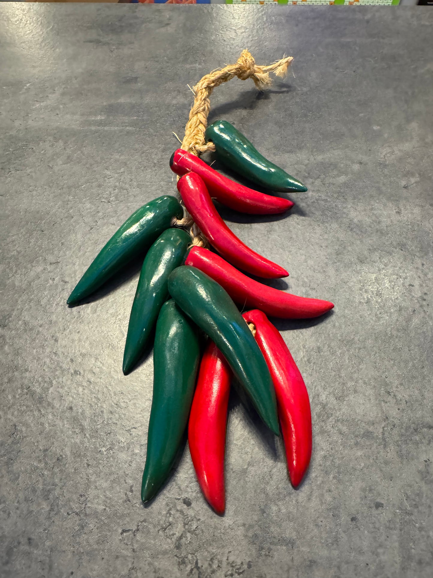 Red and Green Ceramic Peppers on Rope