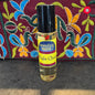 Perfume oil bottle labeled 'Moonlight Rose' with a colorful embroidered background