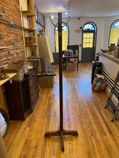 Tall Wooden Coat Rack with Brass Hooks.