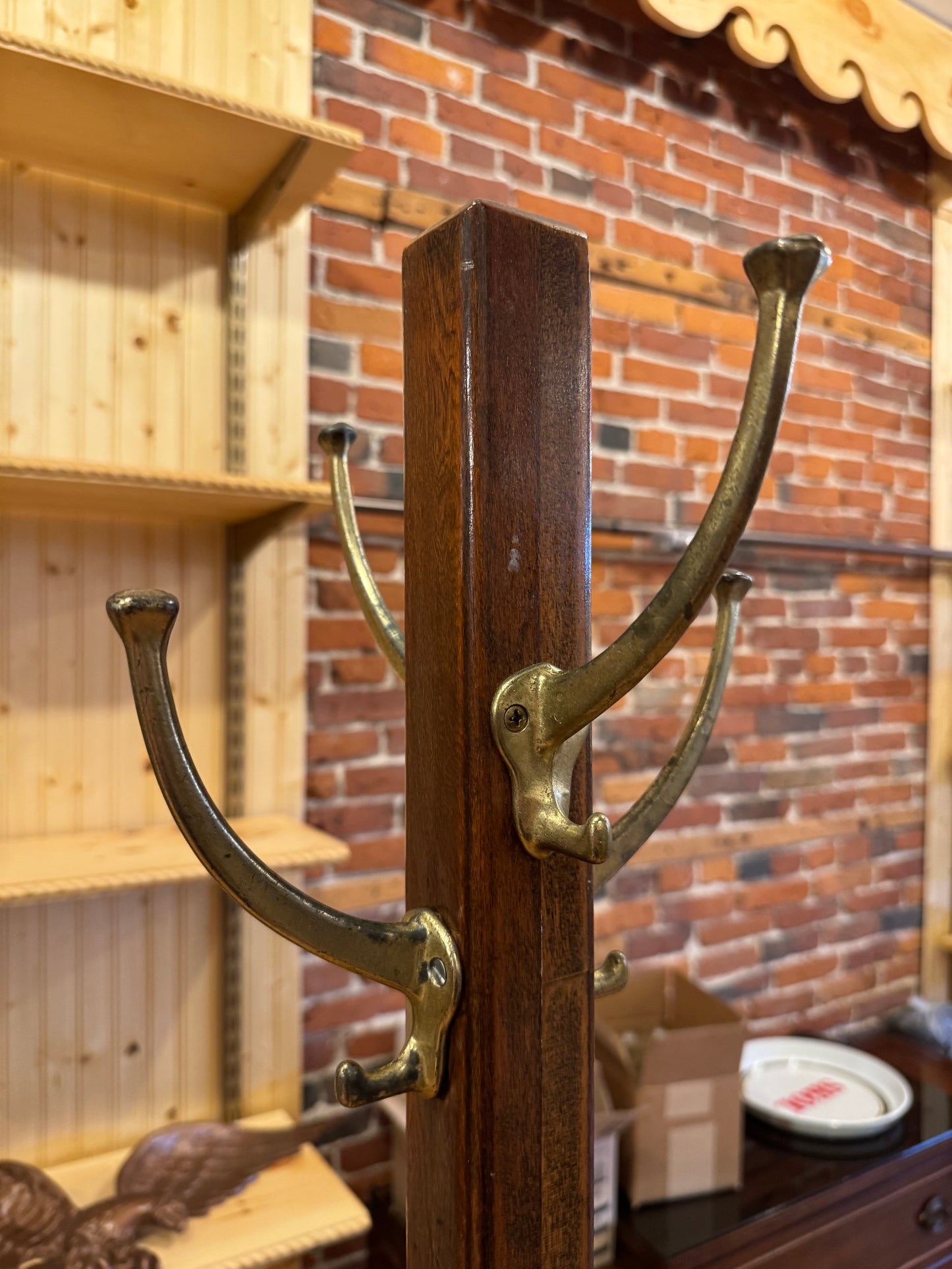 Tall Wooden Coat Rack with Brass Hooks.